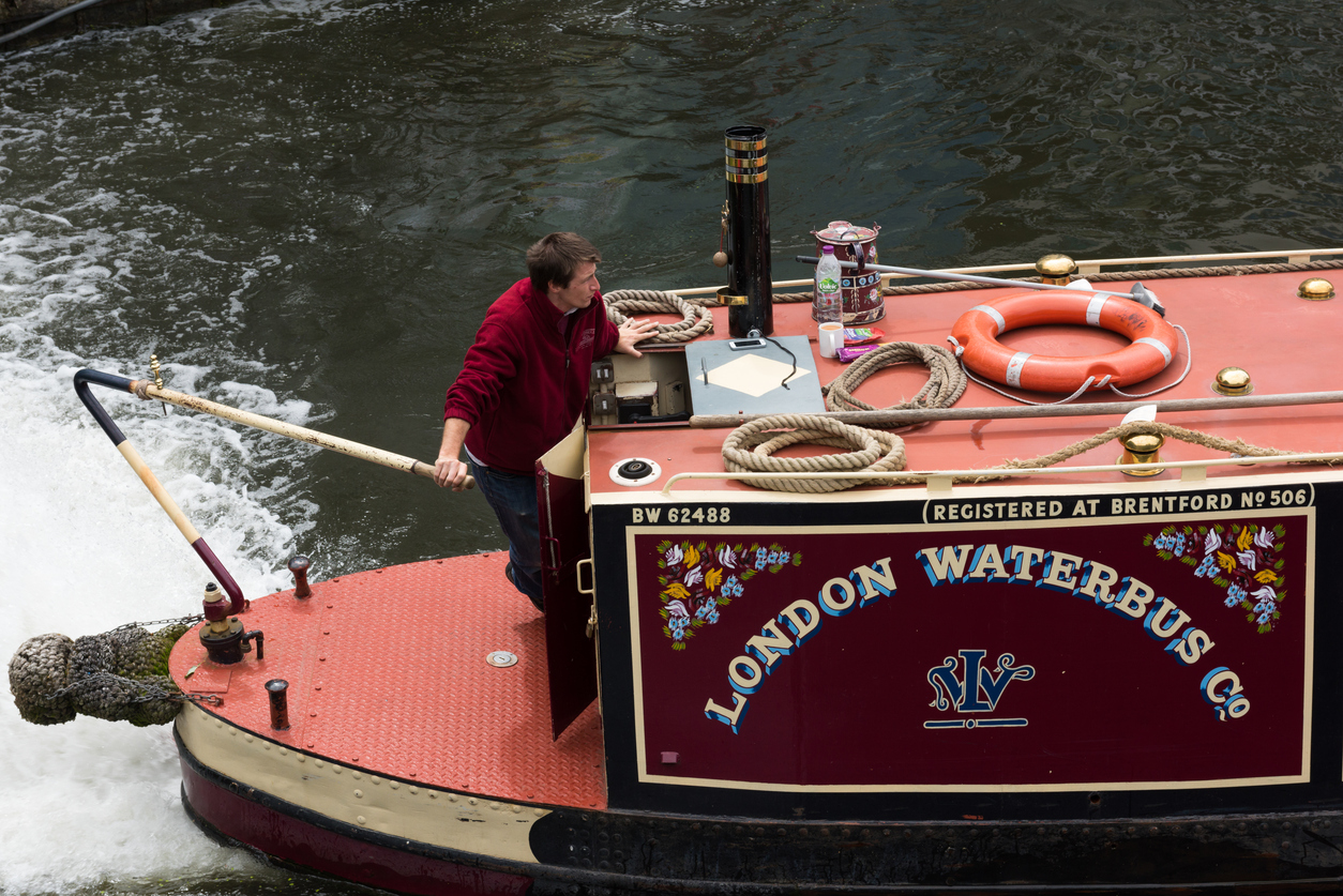 Man driving narrowboat