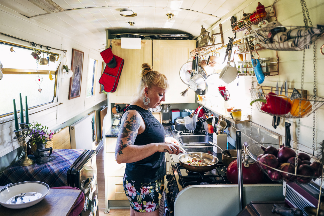 Lady cooking in narrowboat